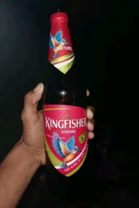 Night Kingfisher Beer Bottle in Hand